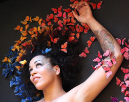 Maya Azucena with butterflies over her head
