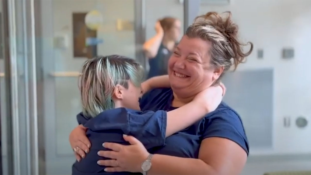 A family hugs with smiles