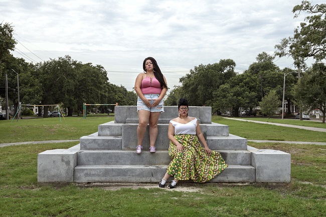 2 women on concrete steps