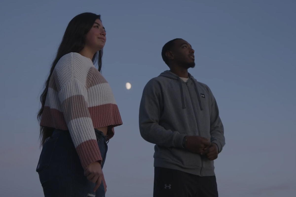 Students watching the moon on campus