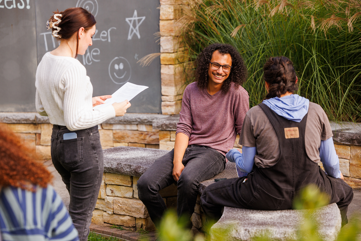 A group of students gathered in the campus courtyard.